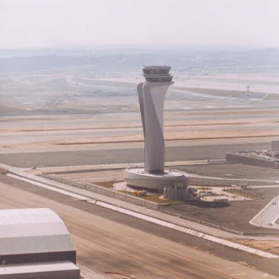 "Perched majestically above the bustling runways, the Air Traffic Control Tower at Istanbul New Airport commands a strategic view of the skies. This aerial perspective captures the hub of precision and coordination, where the tower stands as a sentinel guiding air traffic in and out of this modern aviation gateway